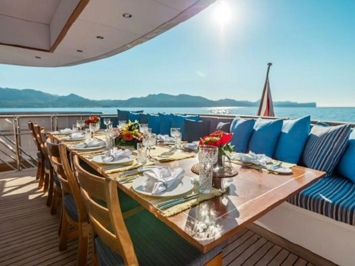 a table set for a dinner party aboard CHARISMA Yacht for Sale