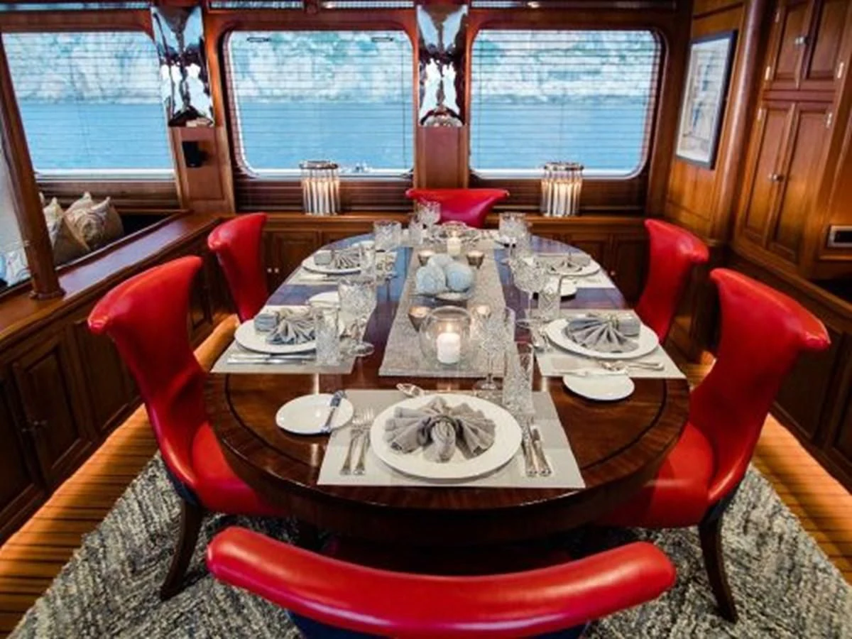 a dining room table aboard CHARISMA Yacht for Sale