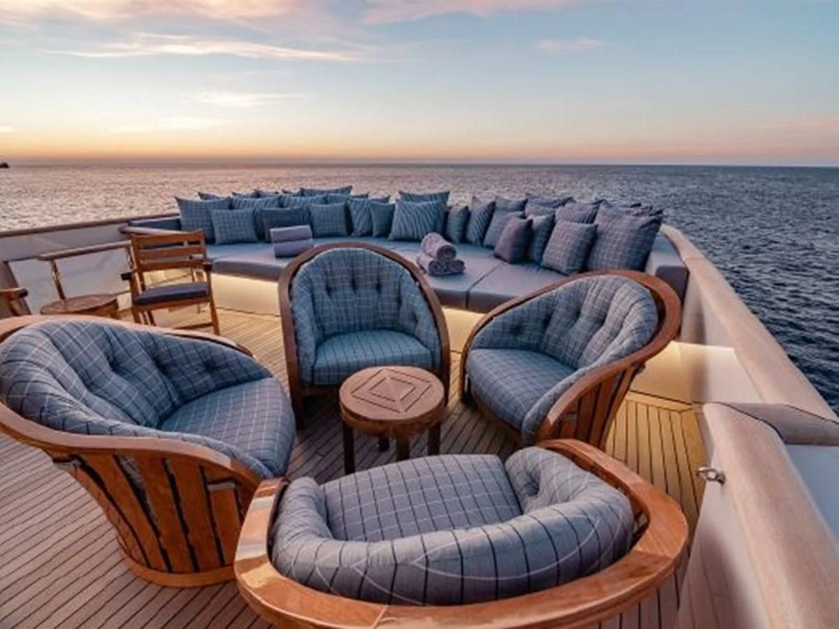 a table with chairs on it aboard CHARISMA Yacht for Sale