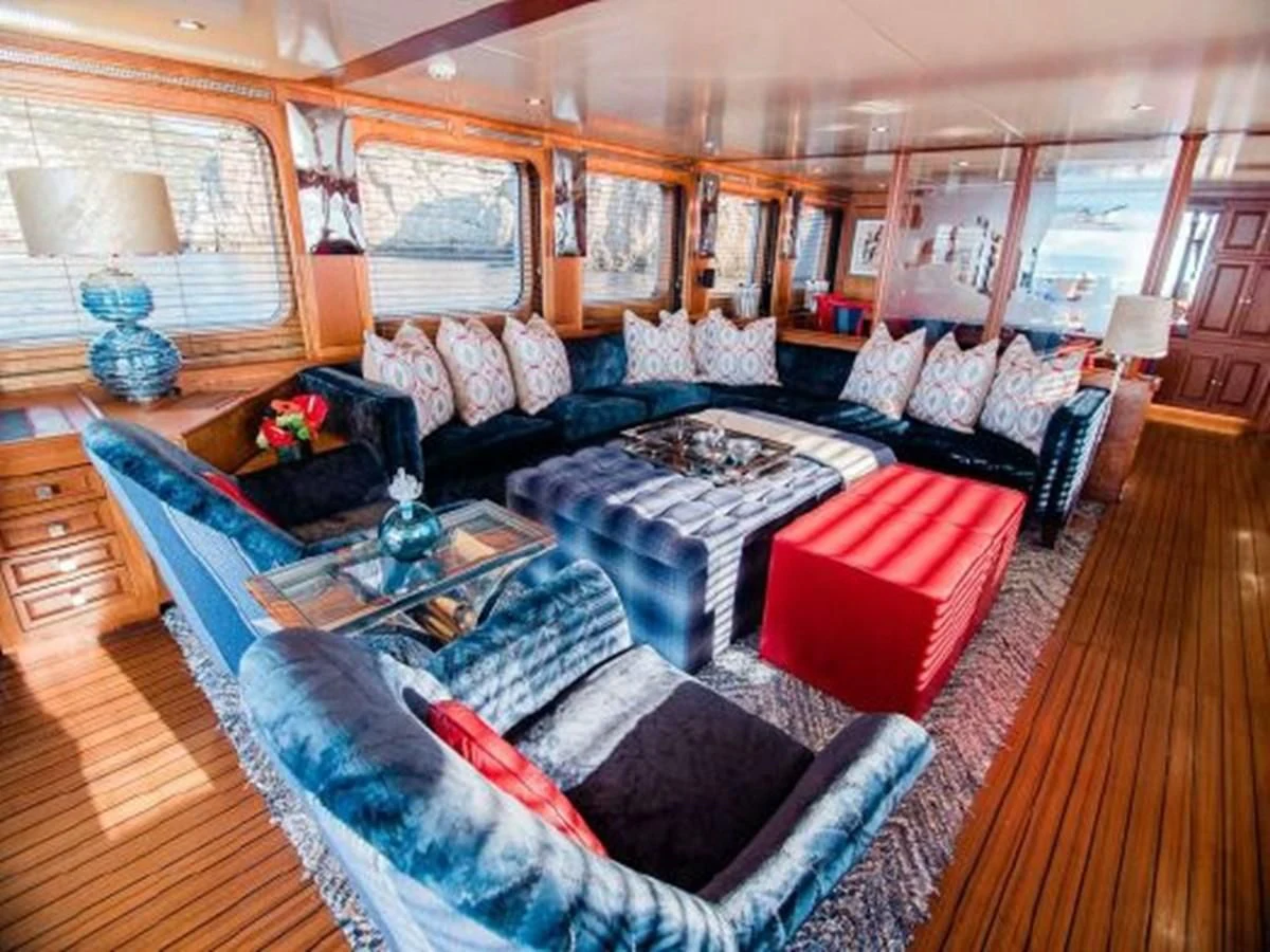 a living room with a large window aboard CHARISMA Yacht for Sale