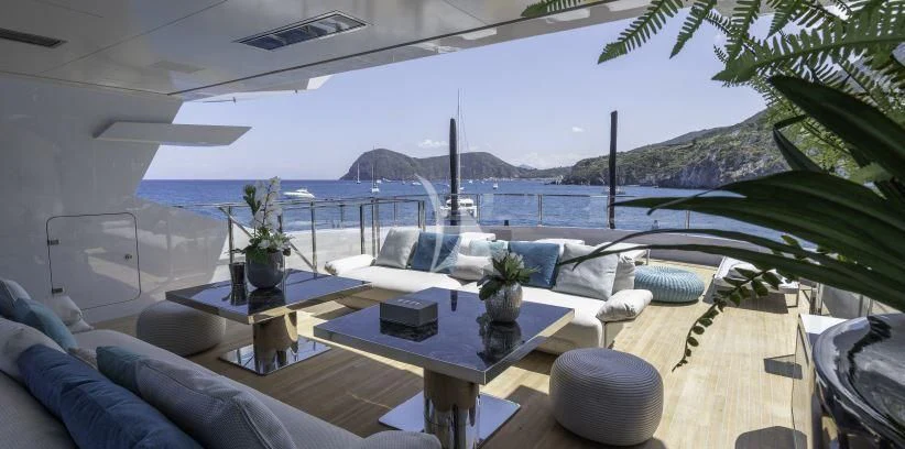 a room with a table and chairs aboard LEL Yacht for Sale