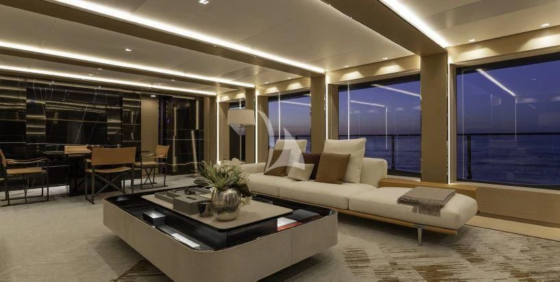 a large room with a couch and a table aboard LEL Yacht for Sale