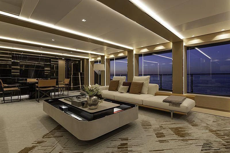 a large room with a table and chairs aboard LEL Yacht for Sale