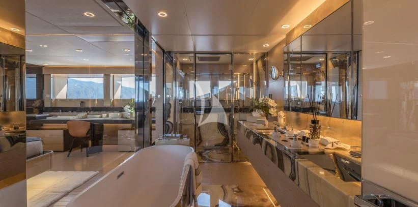a room with tables and chairs aboard LEL Yacht for Sale