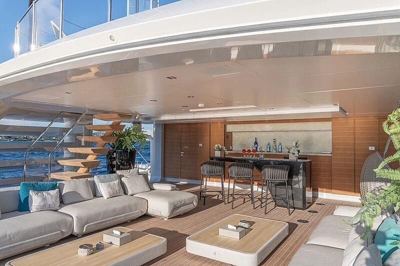 a living room with a couch and a table aboard LEL Yacht for Sale