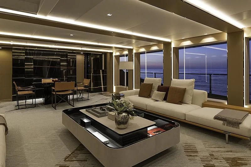 a large room with a couch and a coffee table aboard LEL Yacht for Sale