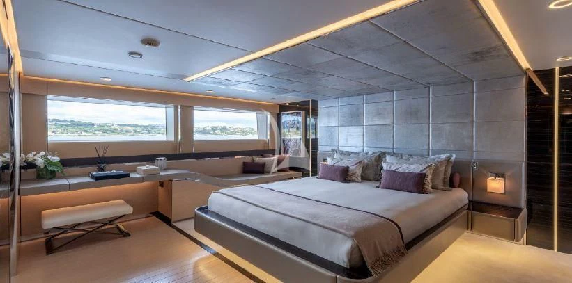 a large bed in a room aboard LEL Yacht for Sale