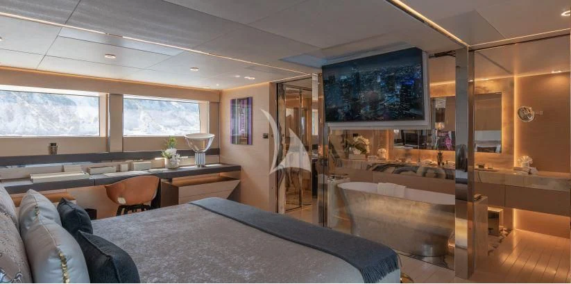 a bedroom with a bed and a tv aboard LEL Yacht for Sale