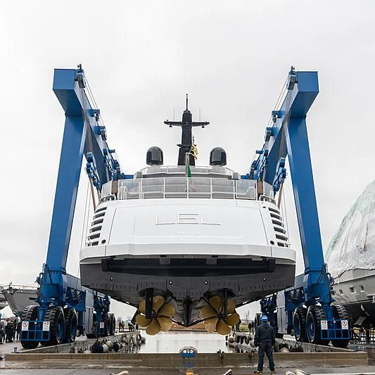 a large white ship with a blue crane aboard LEL Yacht for Sale