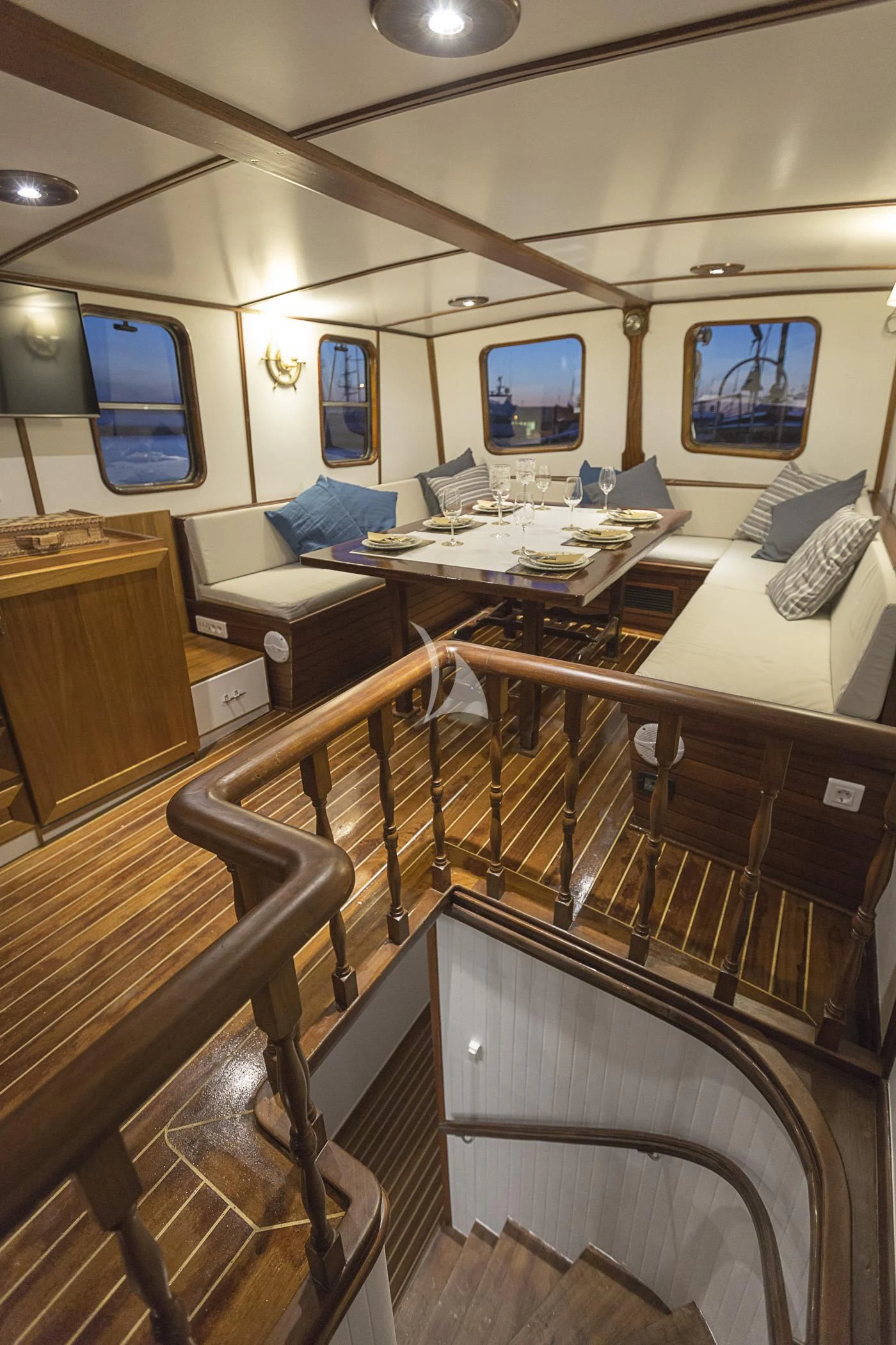 a room with a desk and chairs aboard COSMOS Yacht for Sale