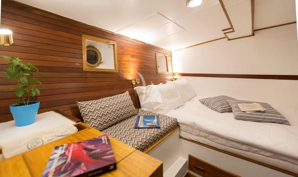 a room with two beds aboard COSMOS Yacht for Sale