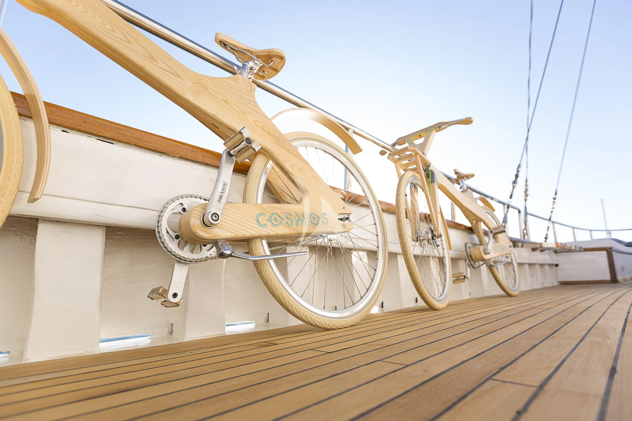 a row of bicycles on a railing aboard COSMOS Yacht for Sale