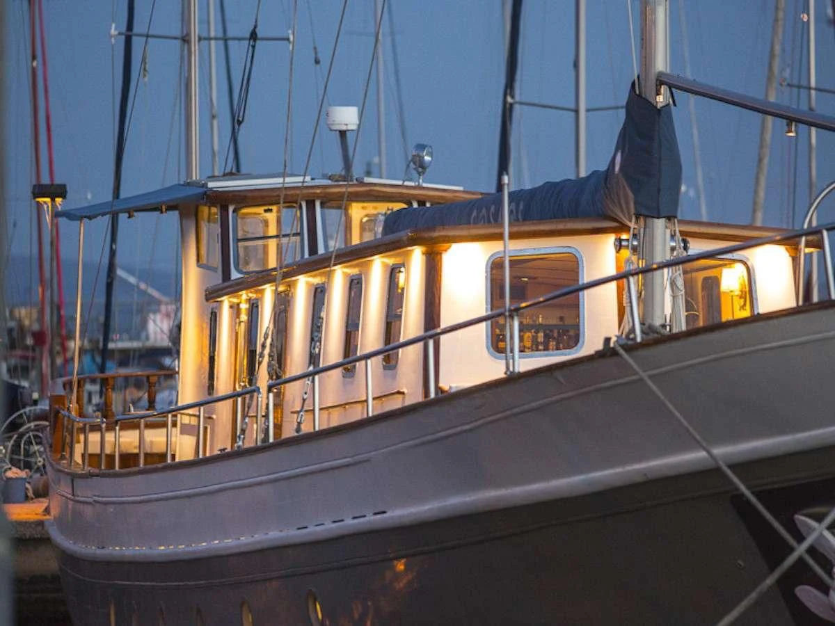 a boat with a sail aboard COSMOS Yacht for Sale