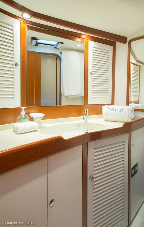 a bathroom with a large mirror aboard FAR OUT Yacht for Sale