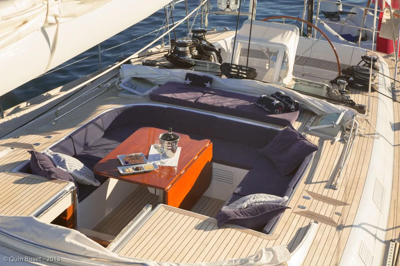 a boat with a table and chairs aboard FAR OUT Yacht for Sale