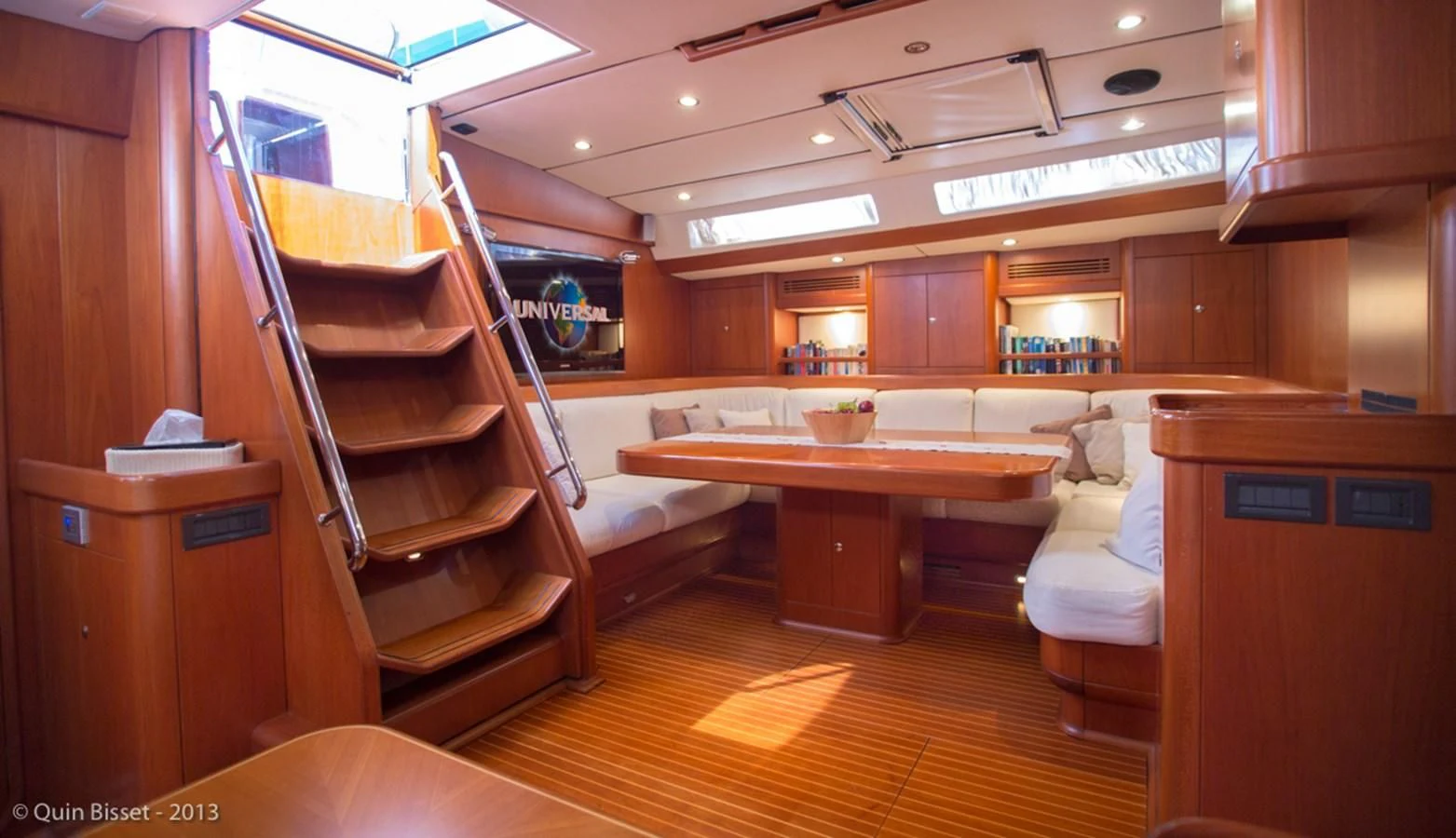 a room with a bed and a desk aboard FAR OUT Yacht for Sale