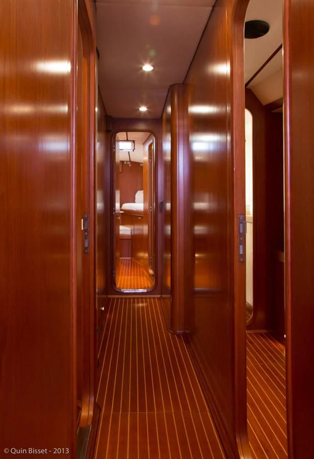a hallway with doors aboard FAR OUT Yacht for Sale