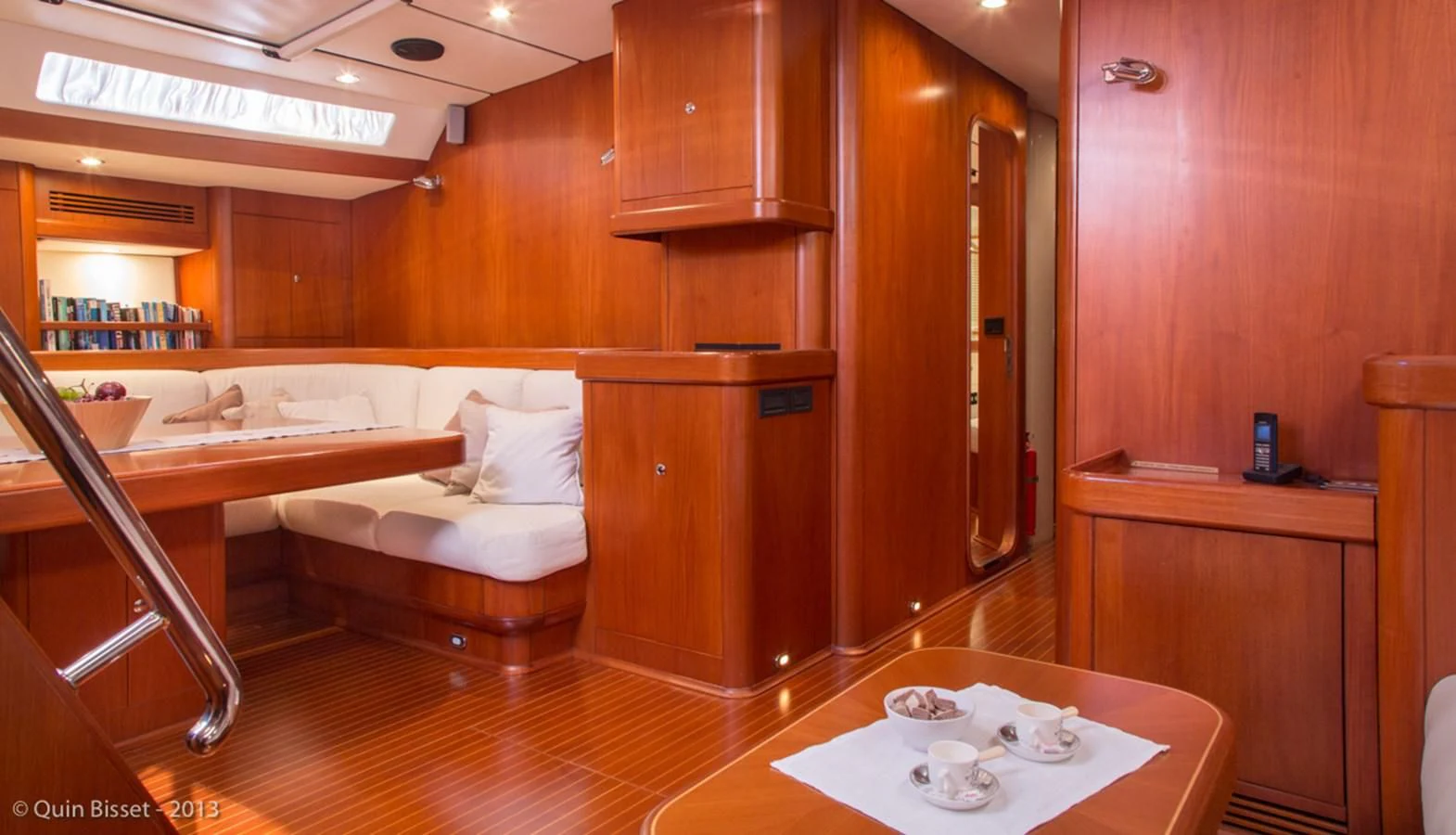 a room with a table and chairs aboard FAR OUT Yacht for Sale