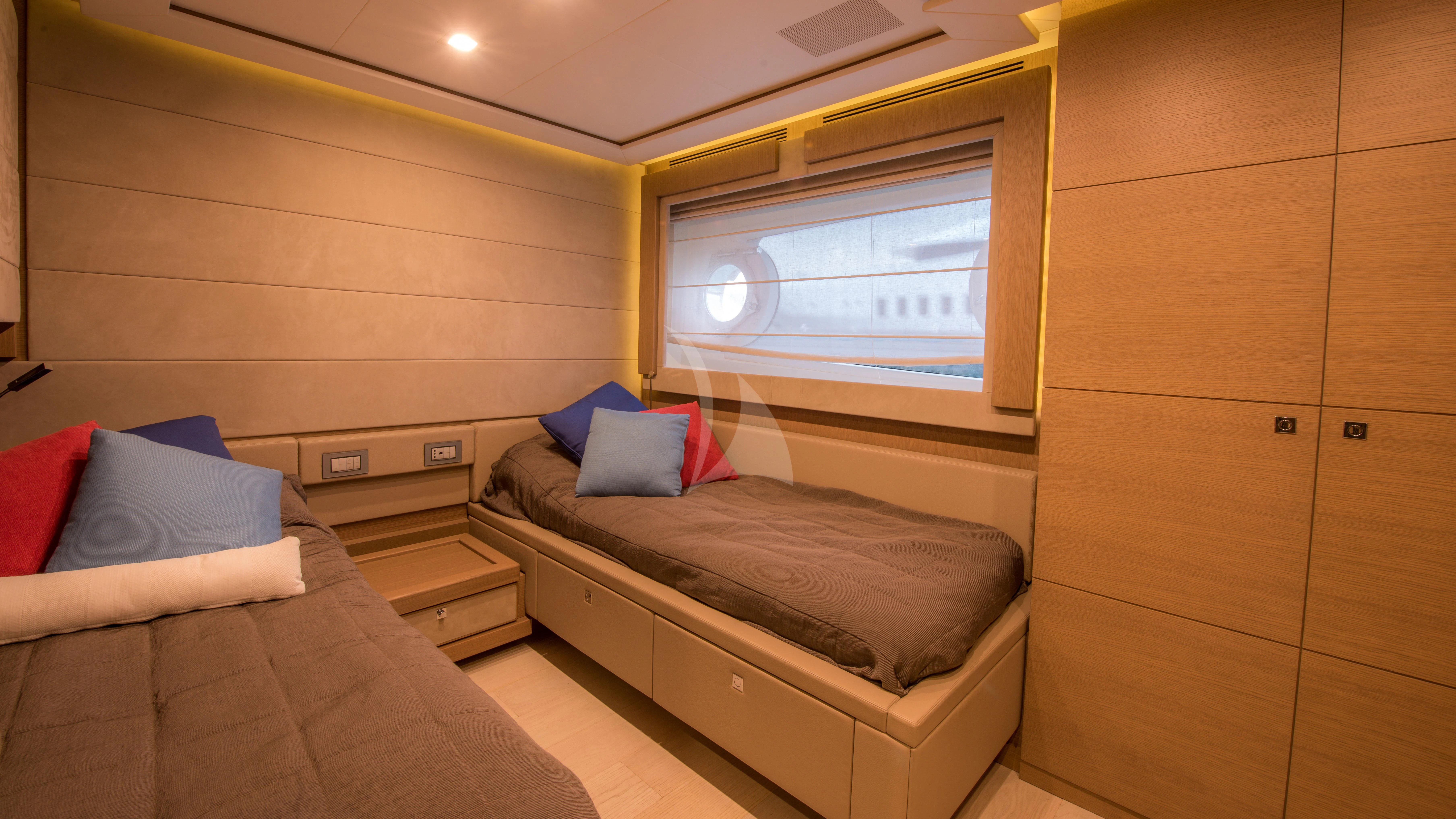 a room with a bed and a tv aboard THALYSSA Yacht for Charter