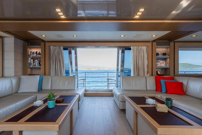 a living room with a large window aboard THALYSSA Yacht for Charter
