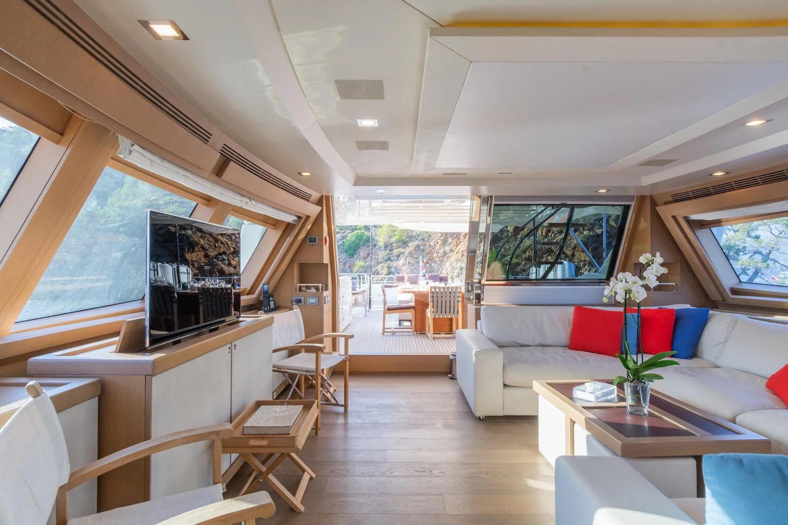 a living room with a couch and a television aboard THALYSSA Yacht for Charter