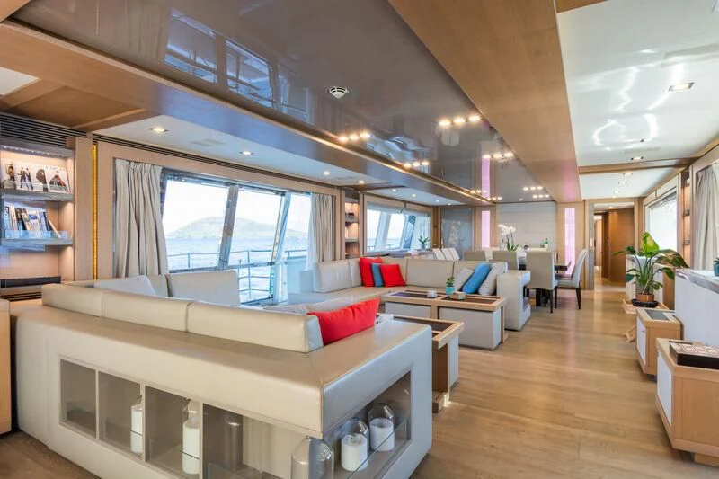 a living room with a large window aboard THALYSSA Yacht for Charter