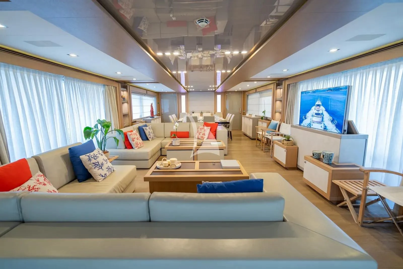 a living room with a large window aboard THALYSSA Yacht for Charter