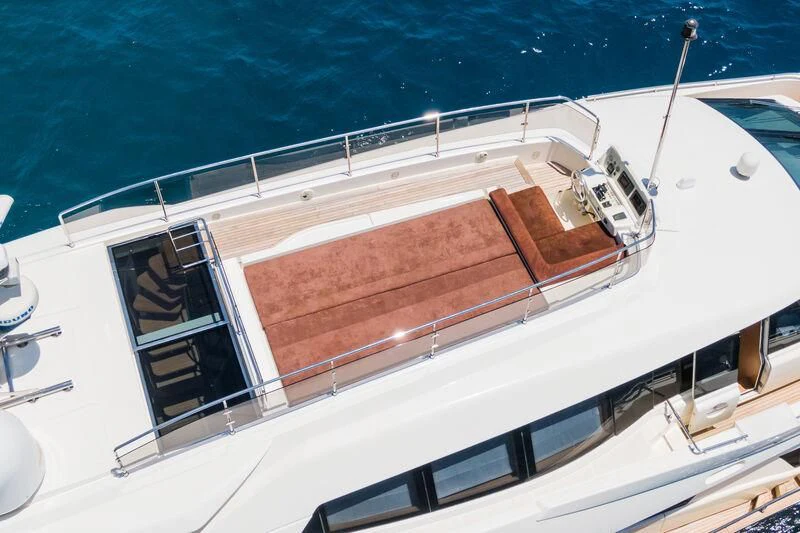 a large white boat on a body of water aboard THALYSSA Yacht for Charter