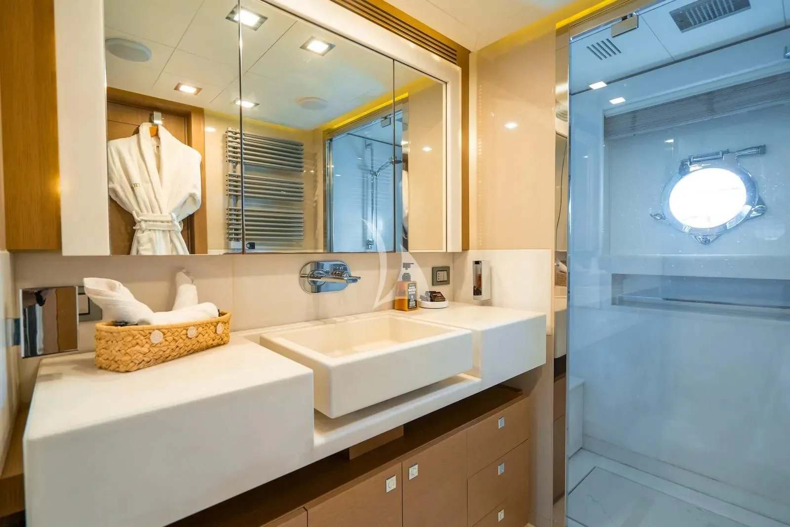 a bathroom with a large mirror aboard THALYSSA Yacht for Charter