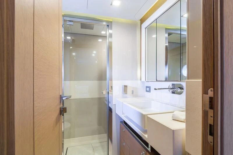 a bathroom with a sink and a shower aboard THALYSSA Yacht for Charter