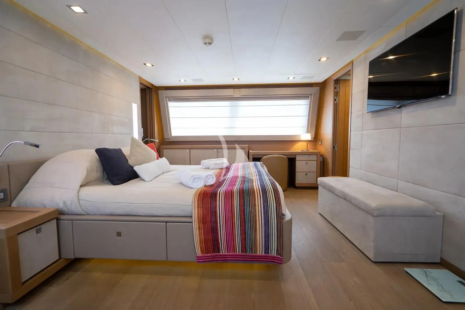 a room with a bed and a couch aboard THALYSSA Yacht for Charter