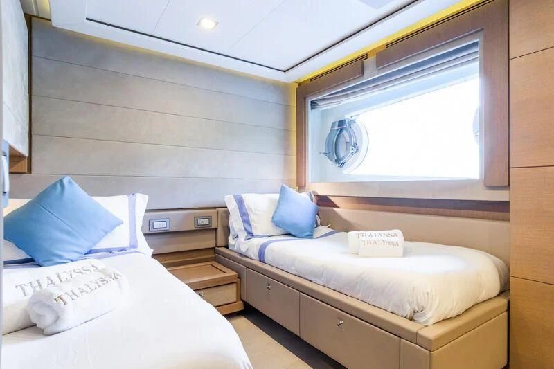 a room with two beds aboard THALYSSA Yacht for Charter