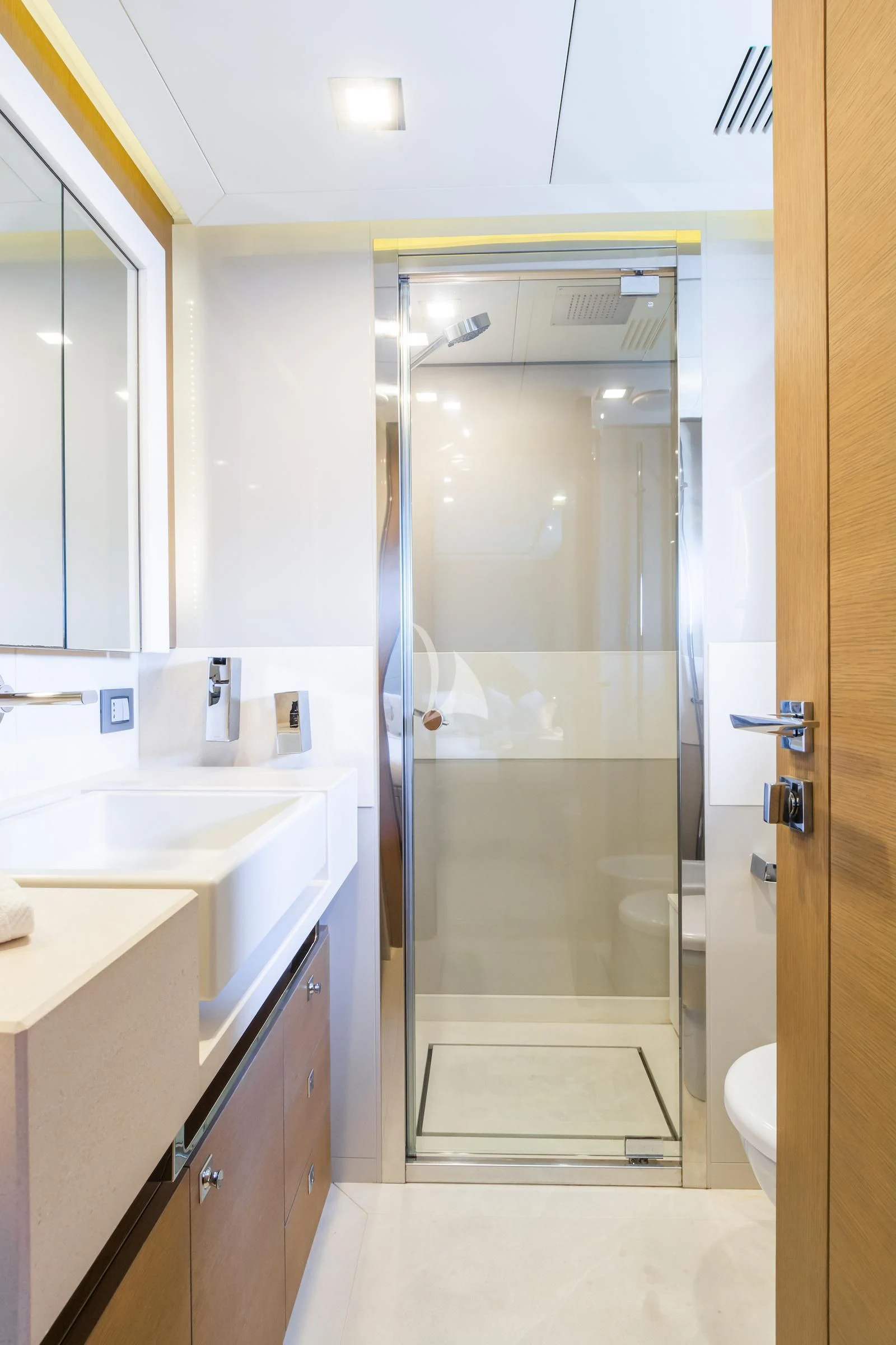 a bathroom with a glass shower aboard THALYSSA Yacht for Charter