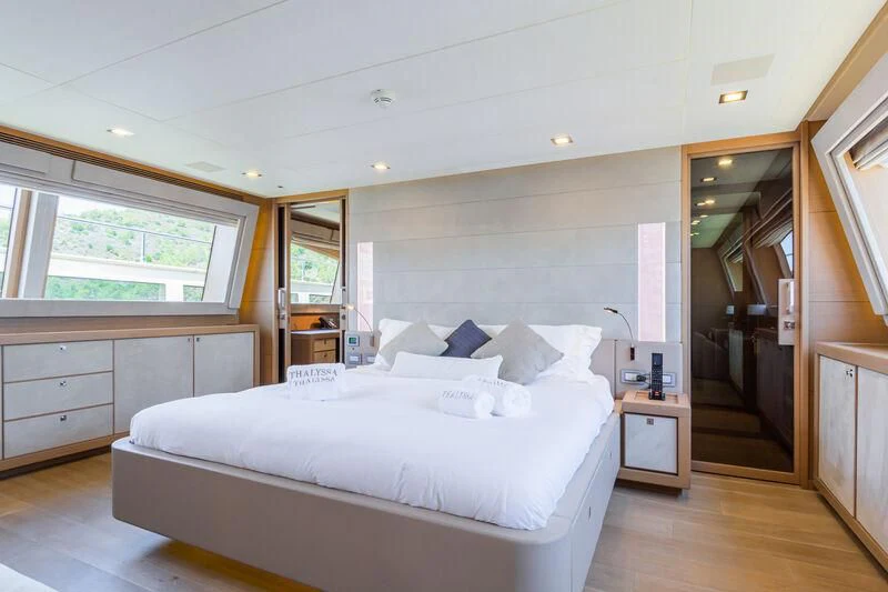 a large bedroom with a large bed aboard THALYSSA Yacht for Charter