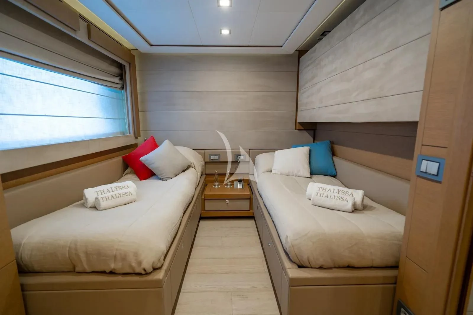 a room with two beds aboard THALYSSA Yacht for Charter
