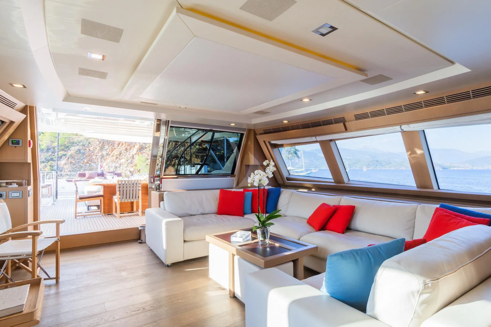 a living room with a large window aboard THALYSSA Yacht for Charter