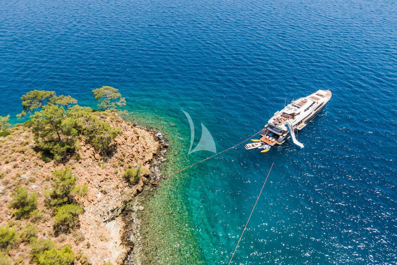 a helicopter flying over a body of water aboard THALYSSA Yacht for Charter