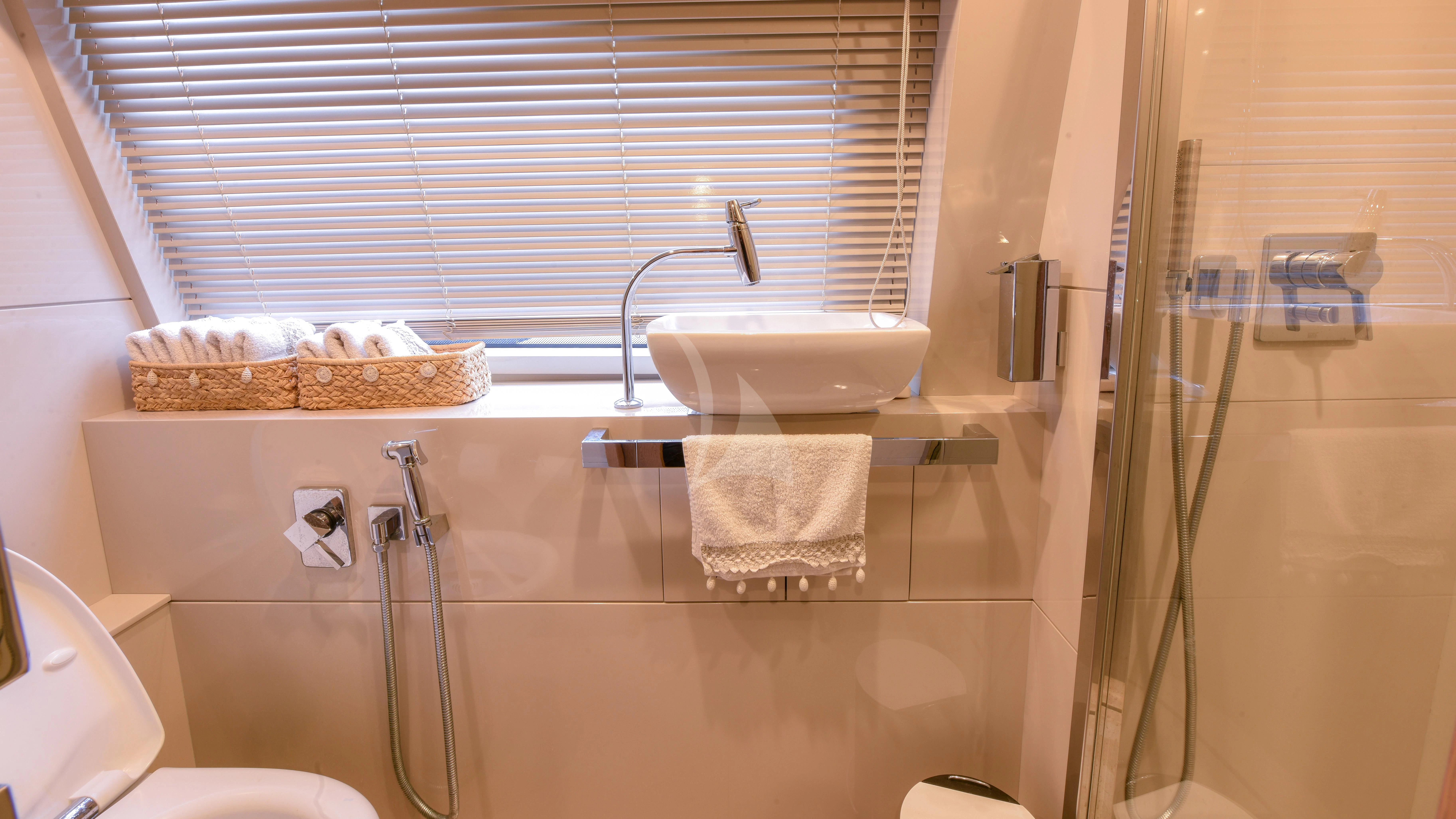 a bathroom with a sink and toilet aboard THALYSSA Yacht for Charter