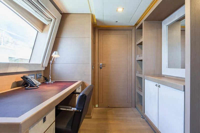 a room with a desk and a chair aboard THALYSSA Yacht for Charter