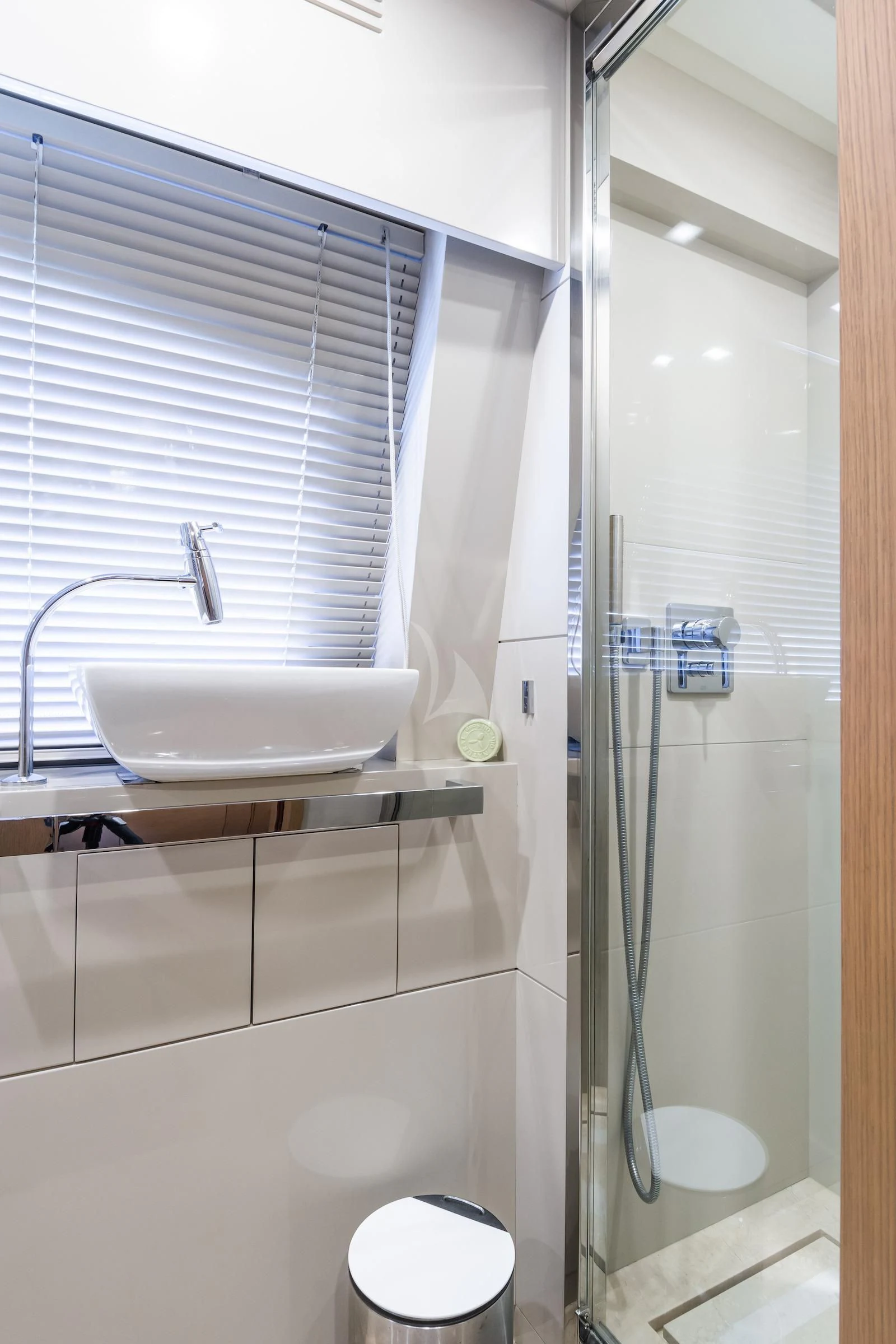 a bathroom with a sink and a shower aboard THALYSSA Yacht for Charter