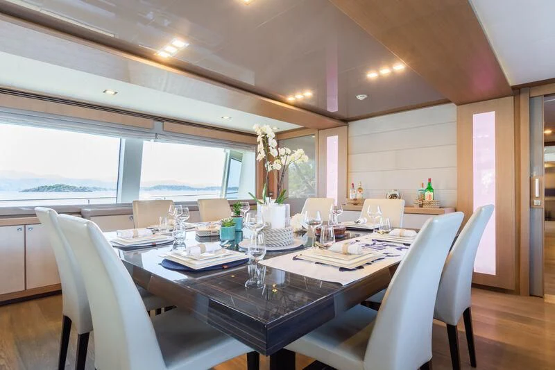 a dining room with a table and chairs aboard THALYSSA Yacht for Charter