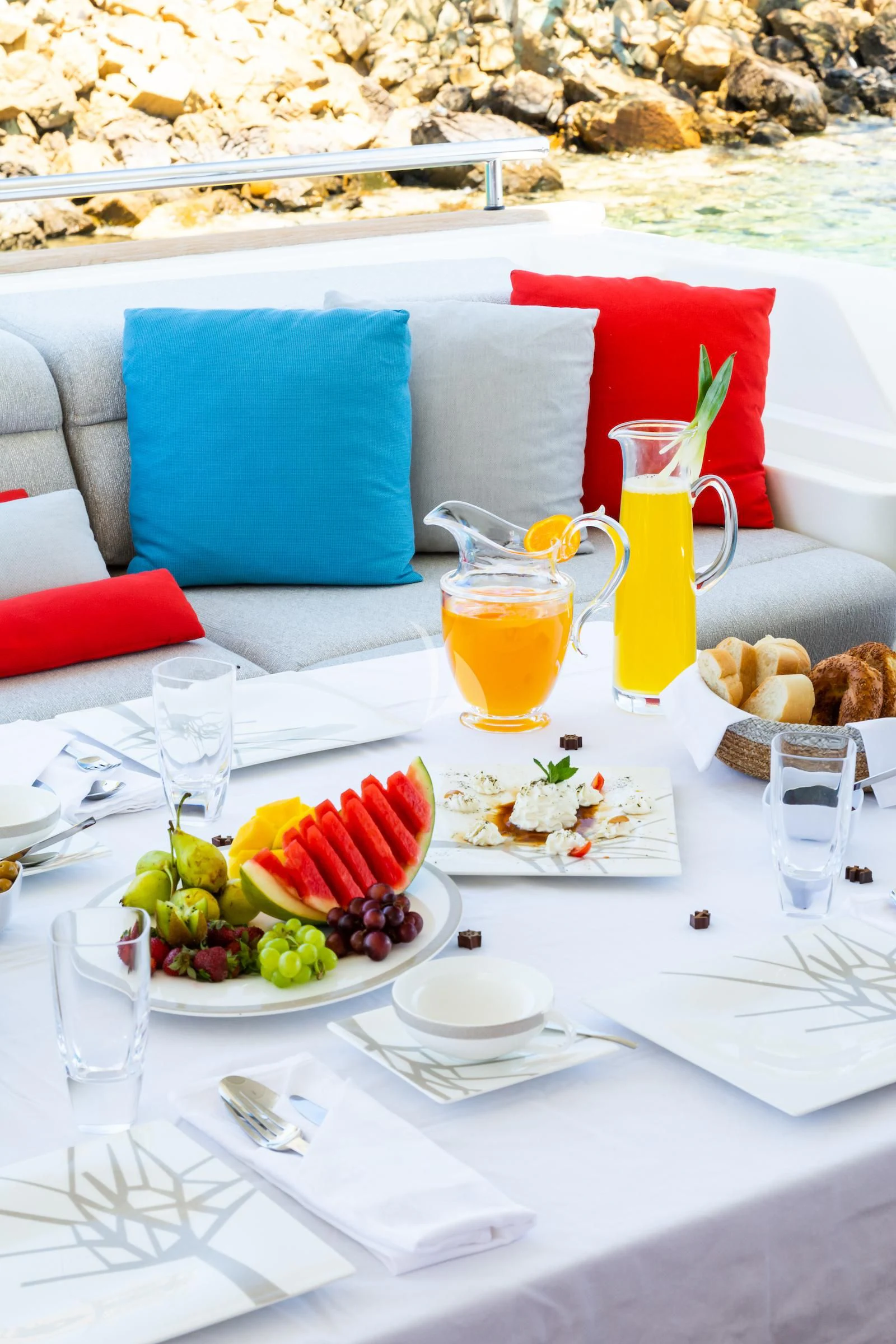 a table with food and drinks on it aboard THALYSSA Yacht for Charter