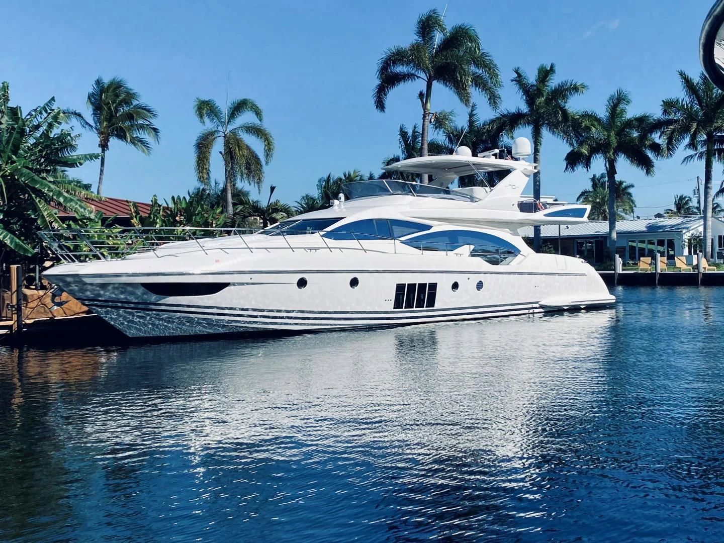 a white yacht in the water aboard SYLVIA VI Yacht for Sale