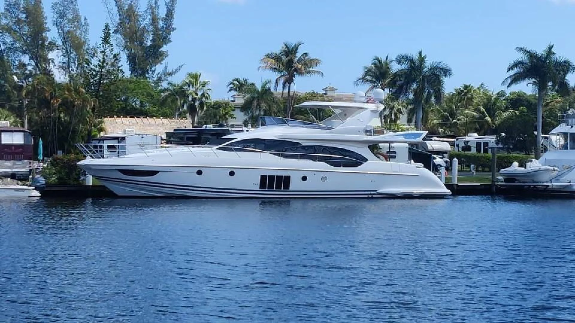 a white yacht in the water aboard SYLVIA VI Yacht for Sale