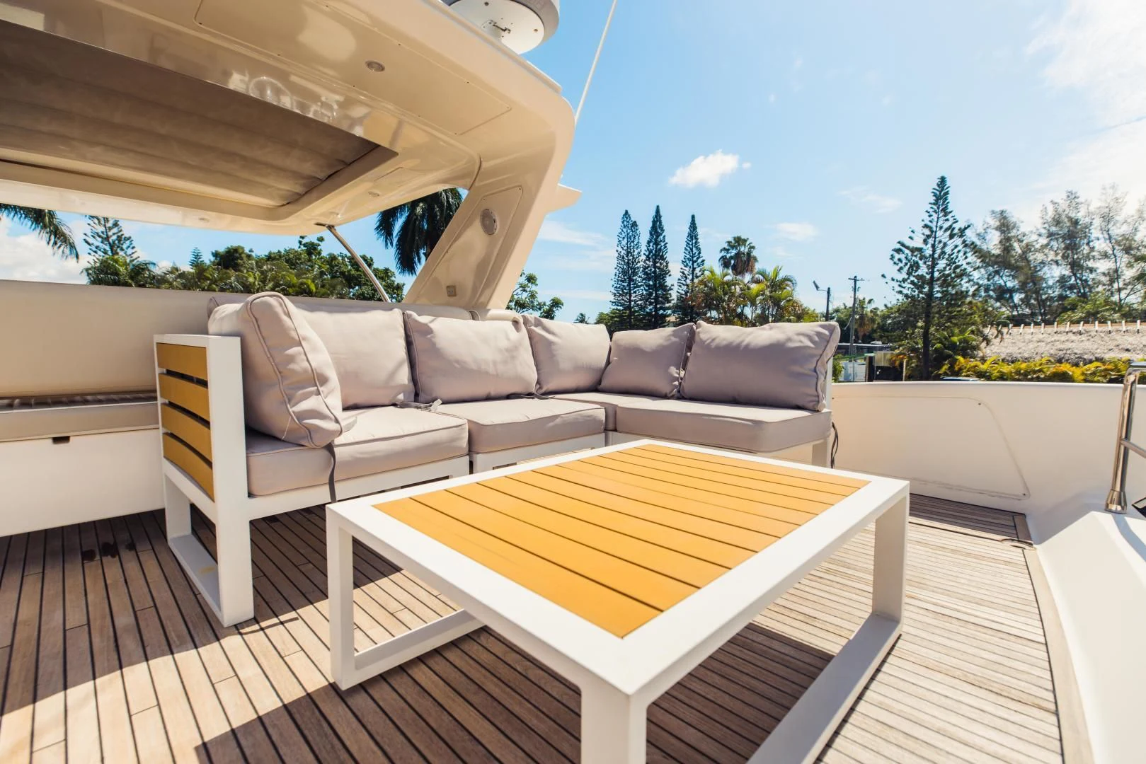 a couch and a table on a deck aboard SYLVIA VI Yacht for Sale