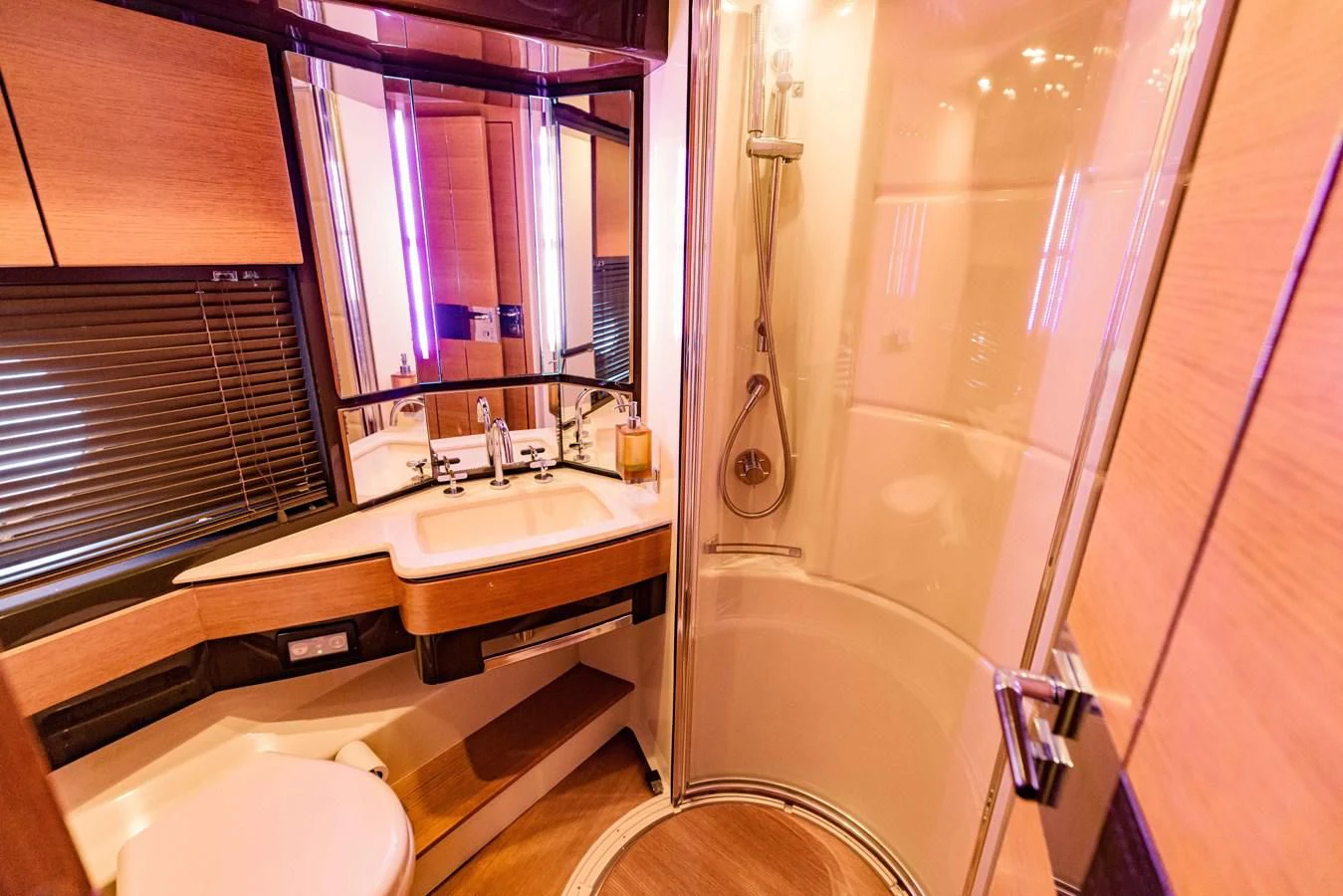 a bathroom with a tub sink and toilet aboard SYLVIA VI Yacht for Sale