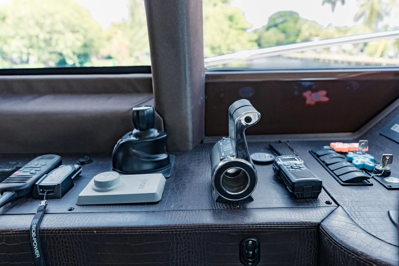 a group of electronics on a table aboard SYLVIA VI Yacht for Sale