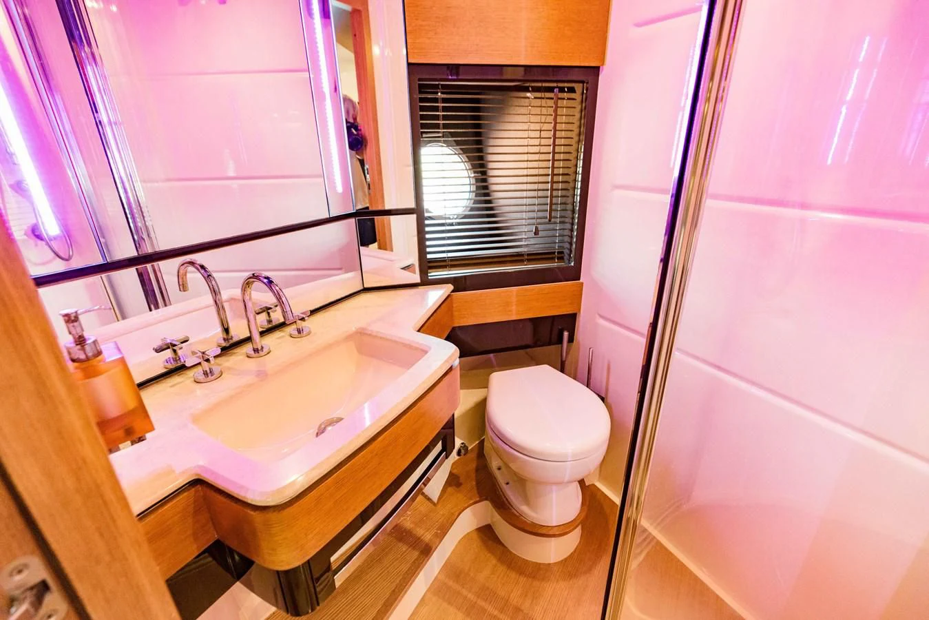 a bathroom with a sink and toilet aboard SYLVIA VI Yacht for Sale