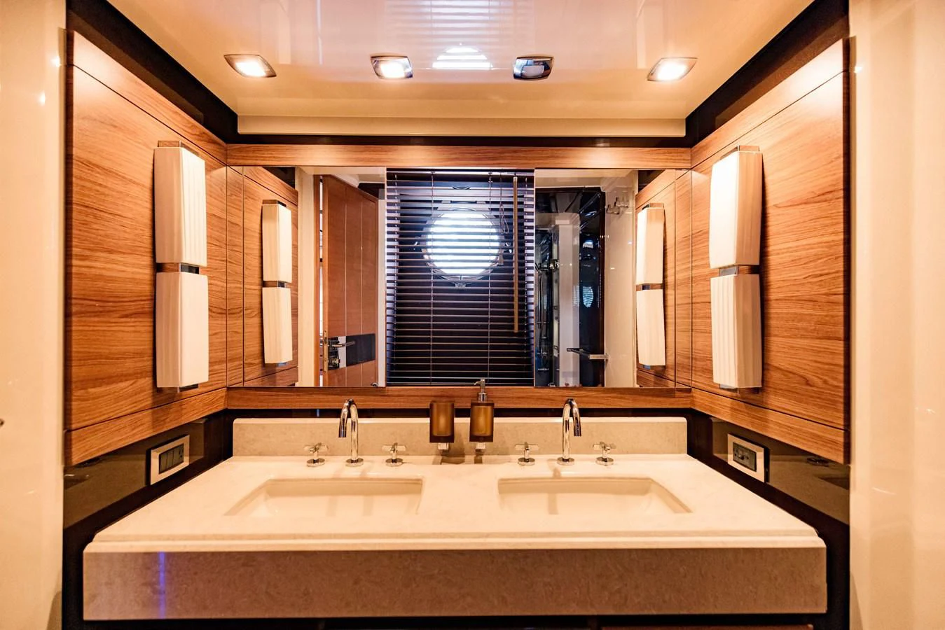 a bathroom with a large mirror aboard SYLVIA VI Yacht for Sale