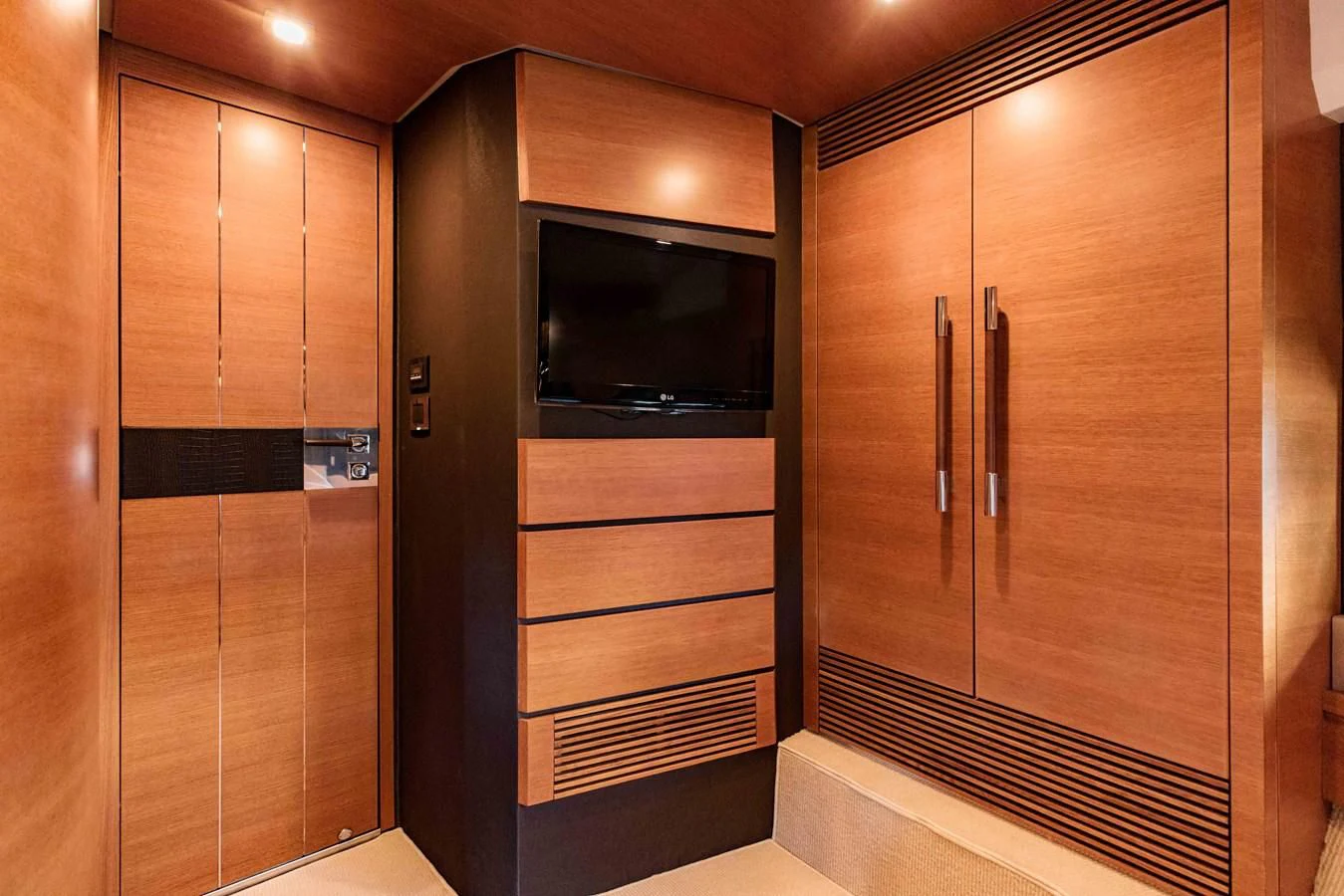 a room with a closet and a microwave aboard SYLVIA VI Yacht for Sale